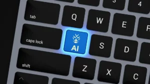 Sur fond noir, détail d'un clavier d'ordinateur (partie gauche du pavé) avec la touche AI en surbrillance bleue